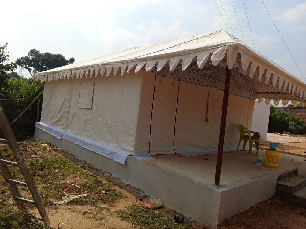 Cream Swiss cottage tent with printed verandah lining